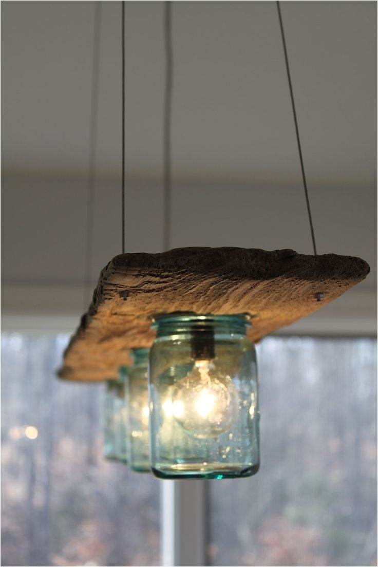possible diy project to give your kitchen or dining room that barn country living style with this unique wood and jar lighting