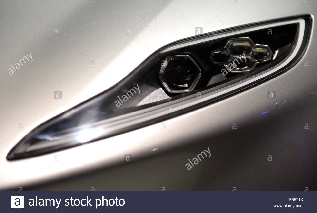 the front headlight of an aston martin