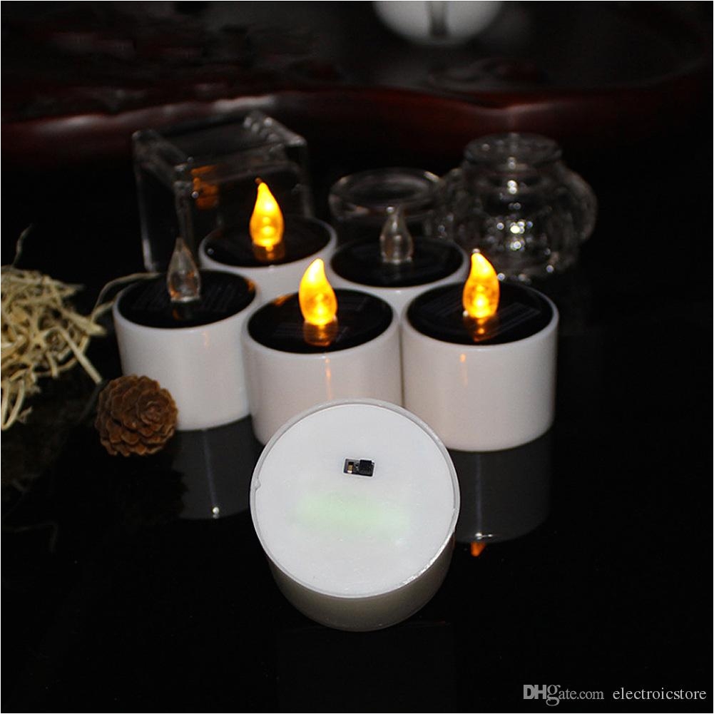 led flameless candle solar powered led candle lamp yellow tea light wedding party home decoration warm white led auto led spot light from electroicstore