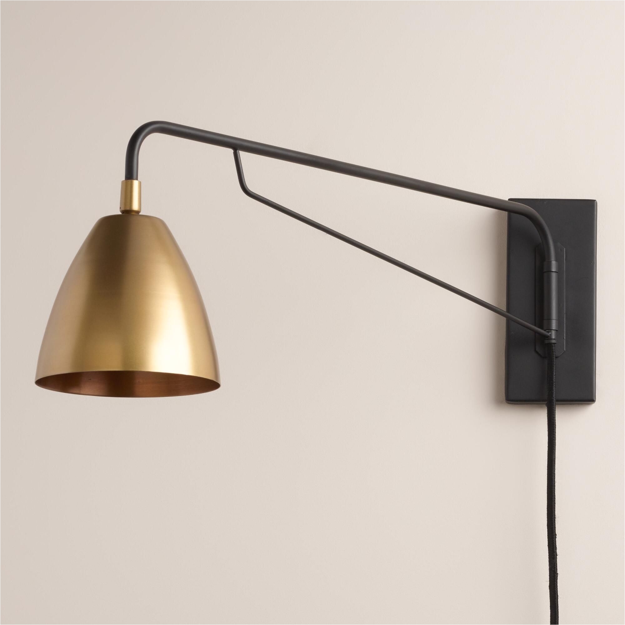 crafted with a pivoting arm and adjustable antique brass shade inspired by mid century modern design our exclusive wall sconce is a custom lighting