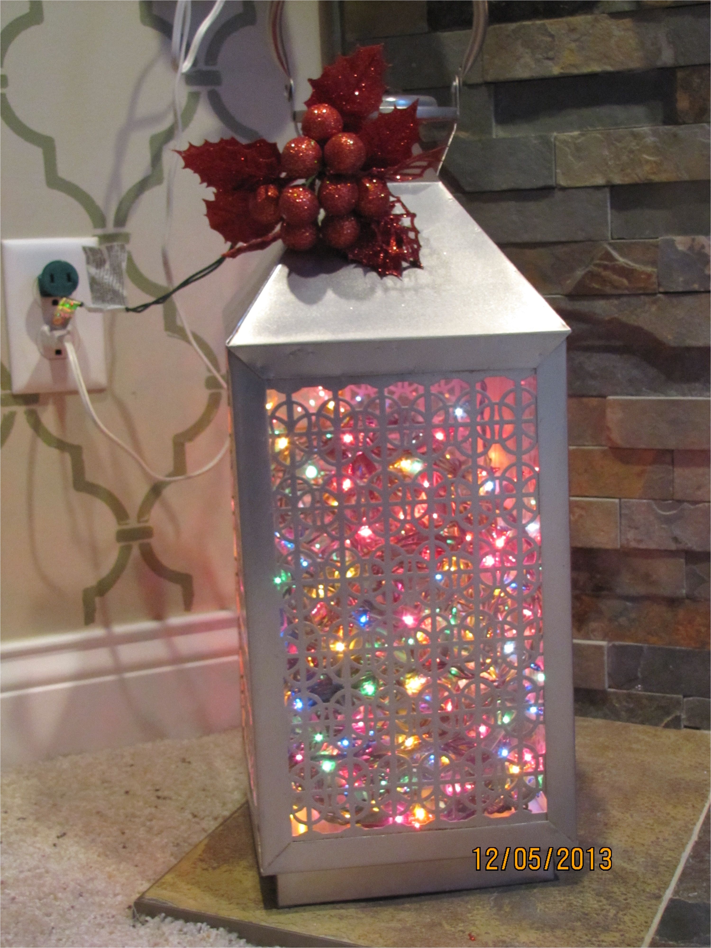 this lantern was an end of summer clearance item from target a while back i think i paid about 15 to make it christmas y i filled it with lights we