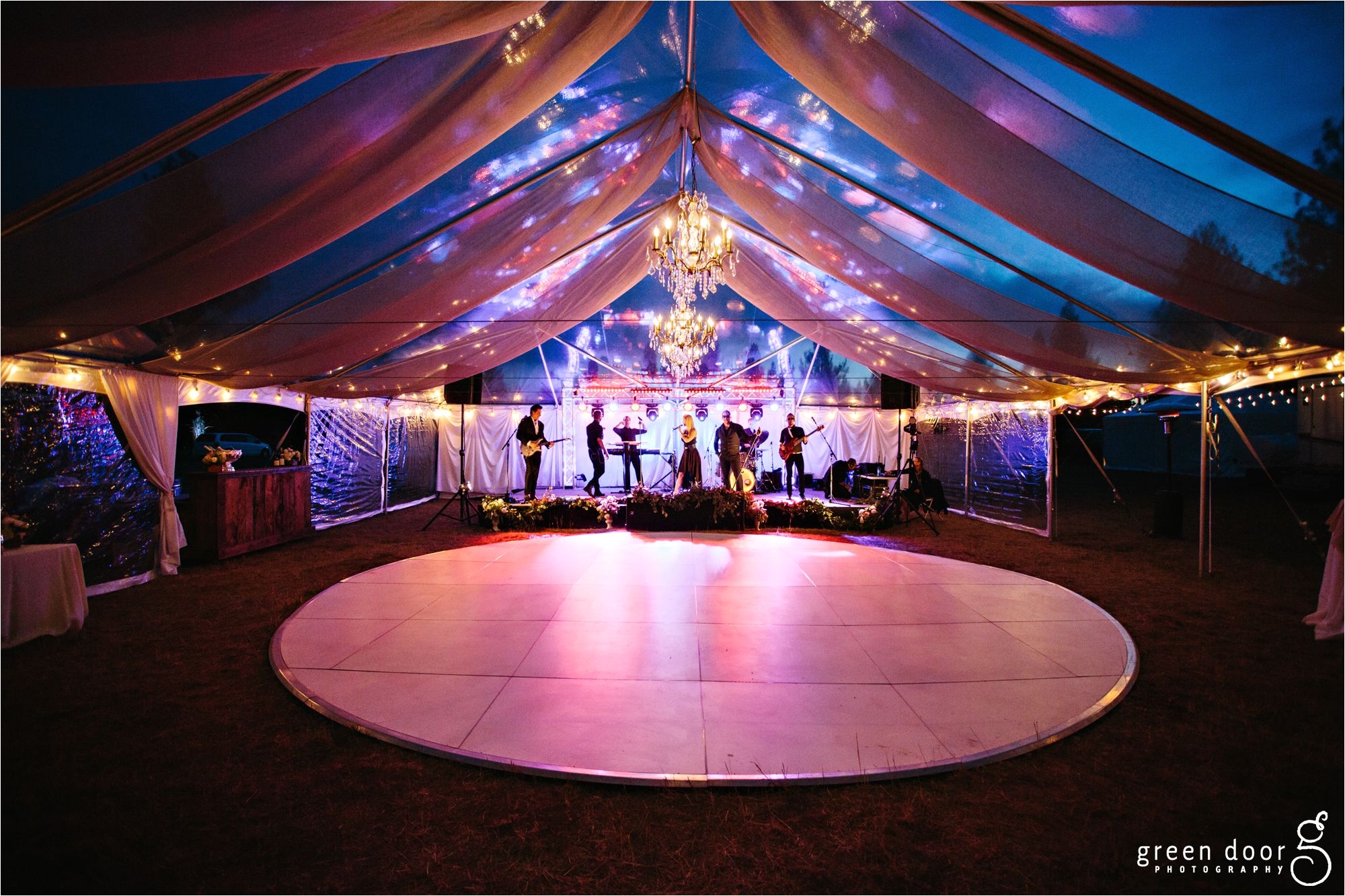 40x60 clear top tent kathy ireland chandeliers up lighting and white circle dance floor
