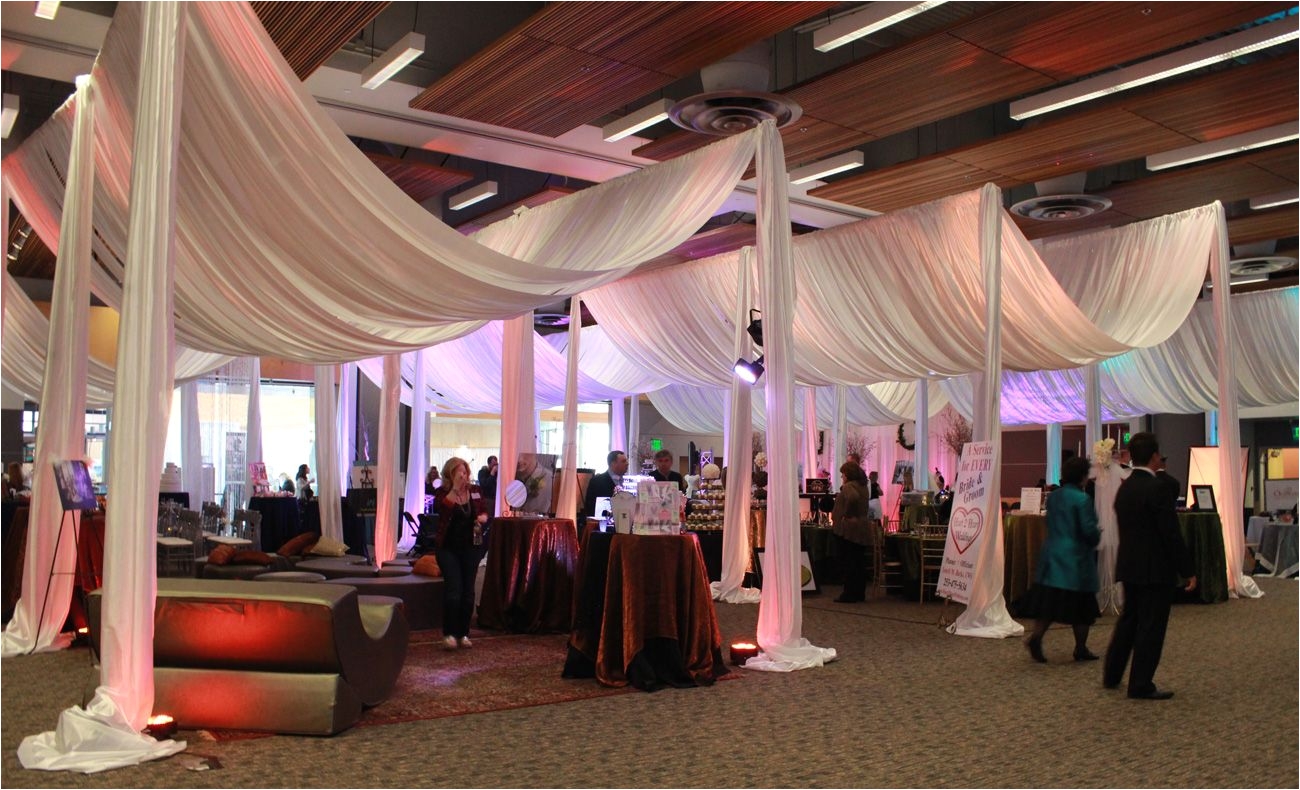 a wedding show with giant white canopies and colored up lighting pj hummel co