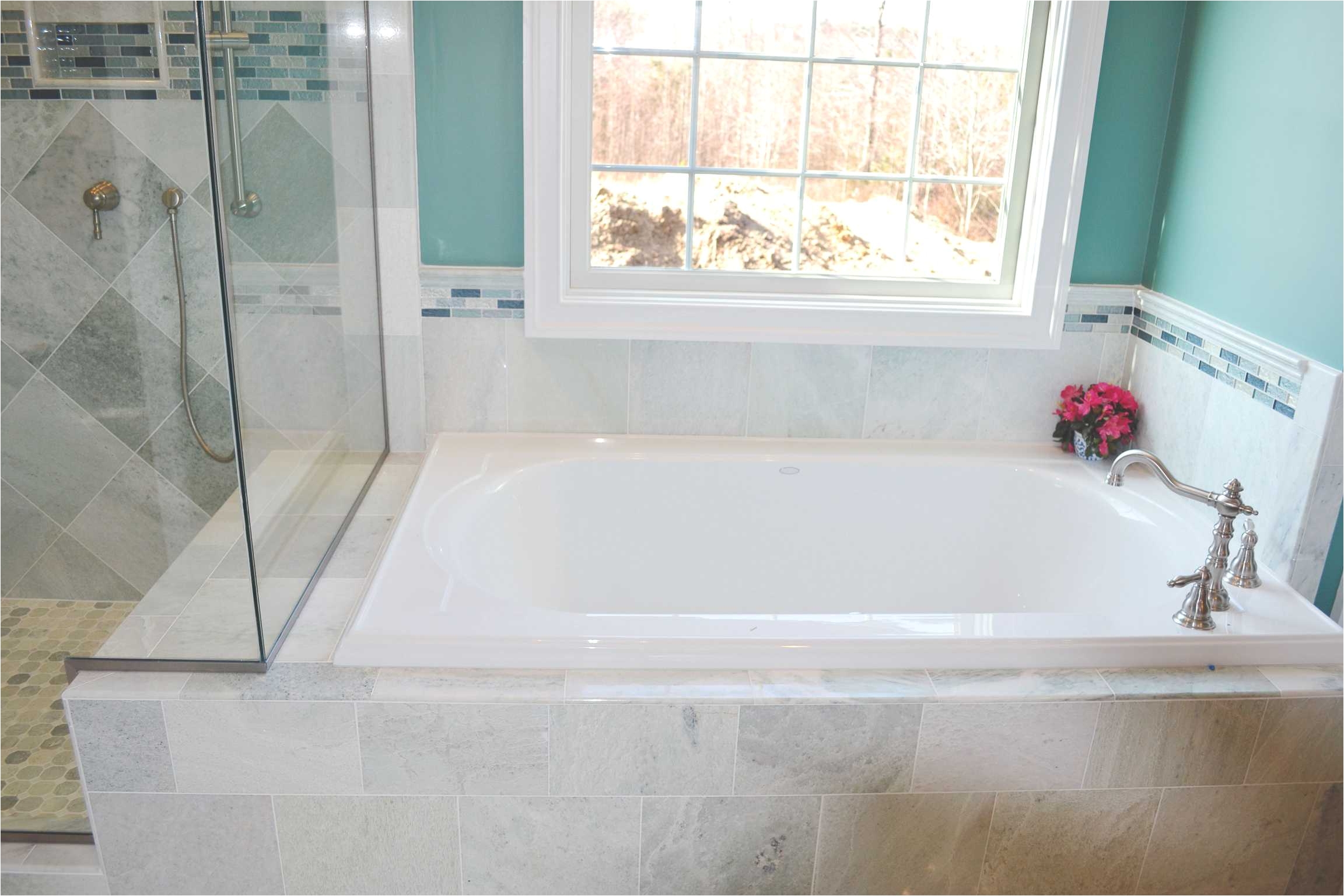 a custom built home by balducci builders inc this spa like bathroom features a cool blue