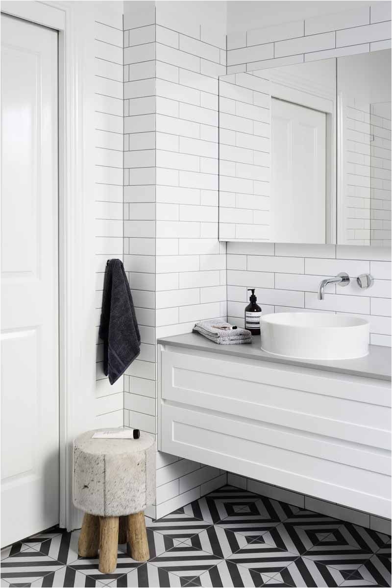 Bold floor tile in this white bathroom design ELWOOD Bathroom and Kitchen Renovations and