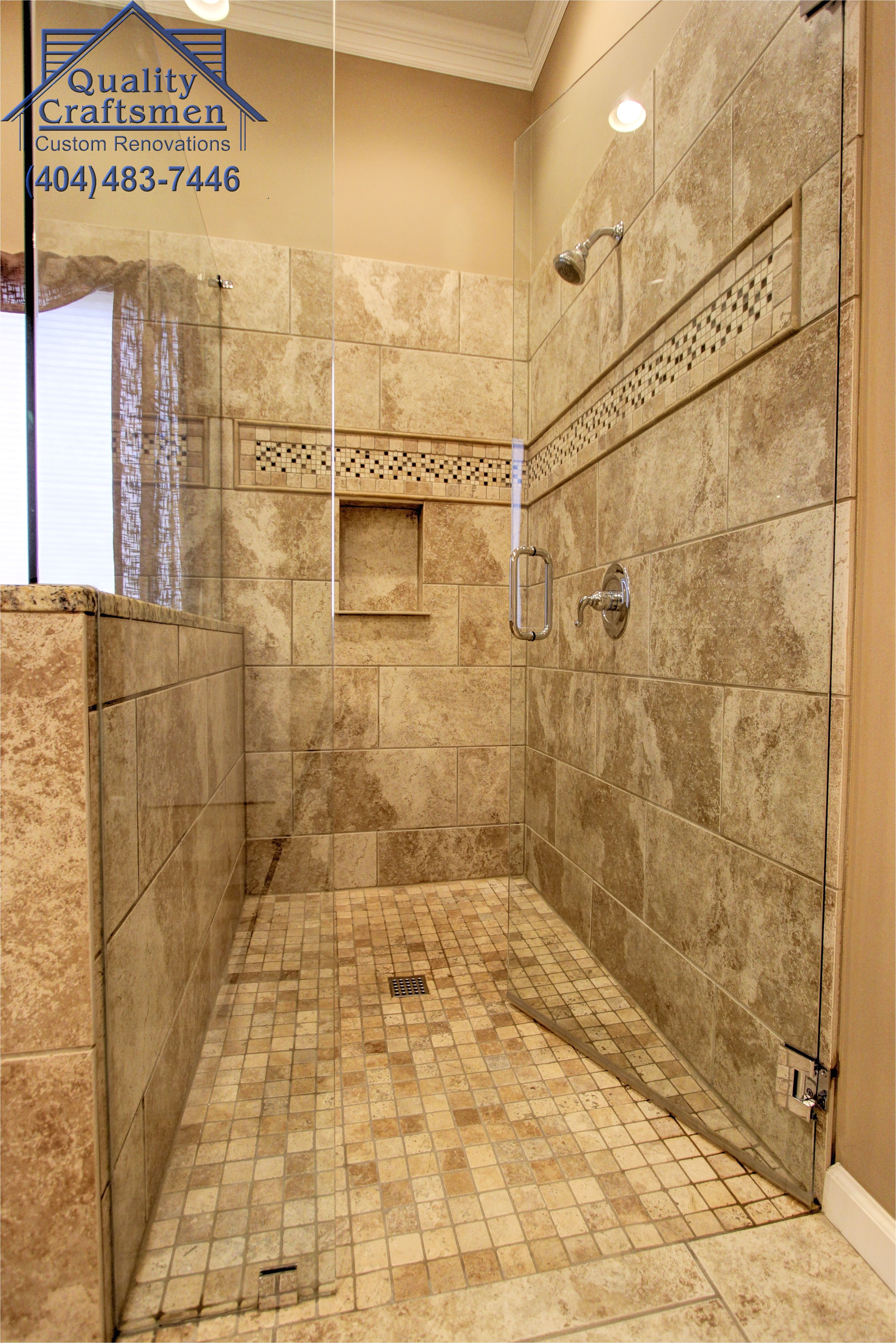 No curb walk in master shower Travertine tile and recycled glass accent Travertine