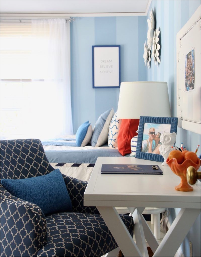 Layers of navy blue white and pops of orange are speckled throughout the room When picking out a color pallete and using color I use the 60 30 10 ratio
