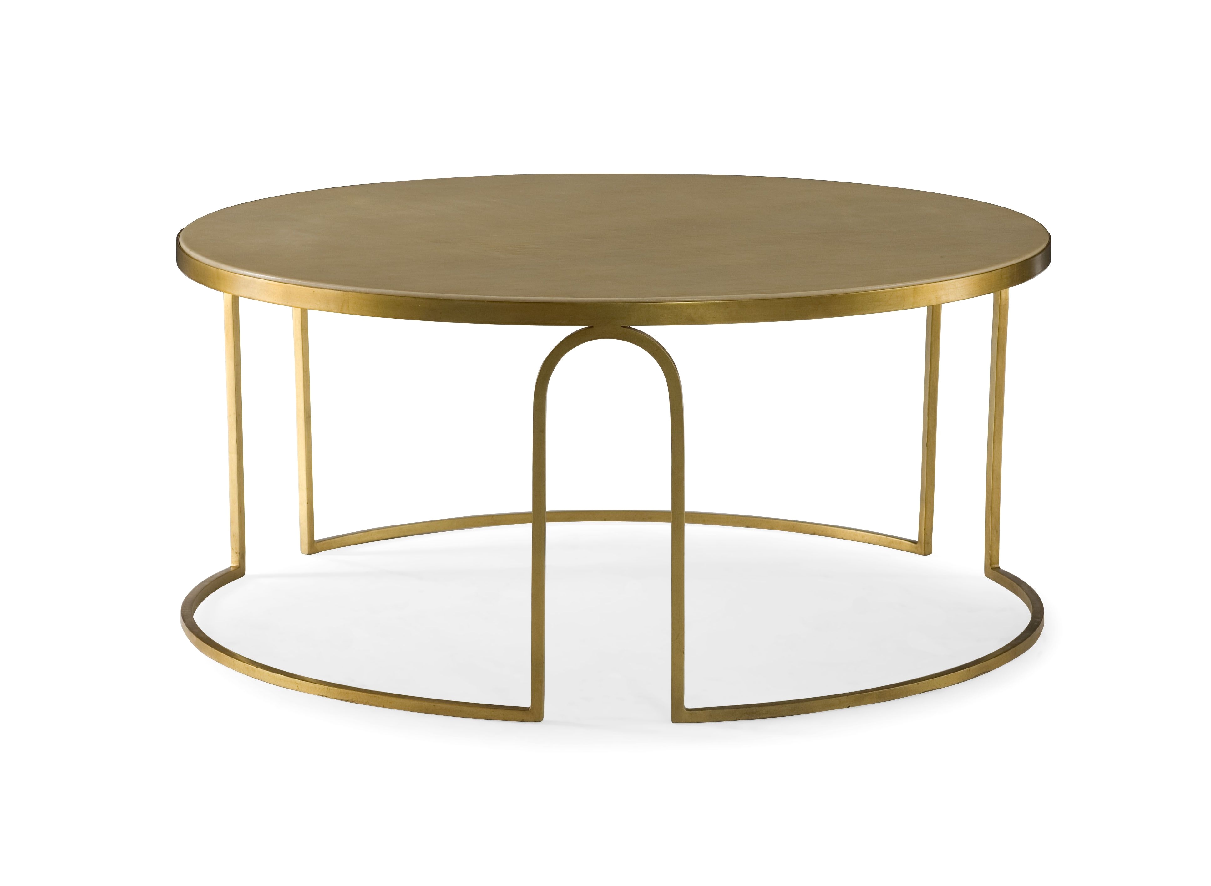 A transitional round coffee table featuring a cream faux vellum top and an art deco inspired gold leaf steel base