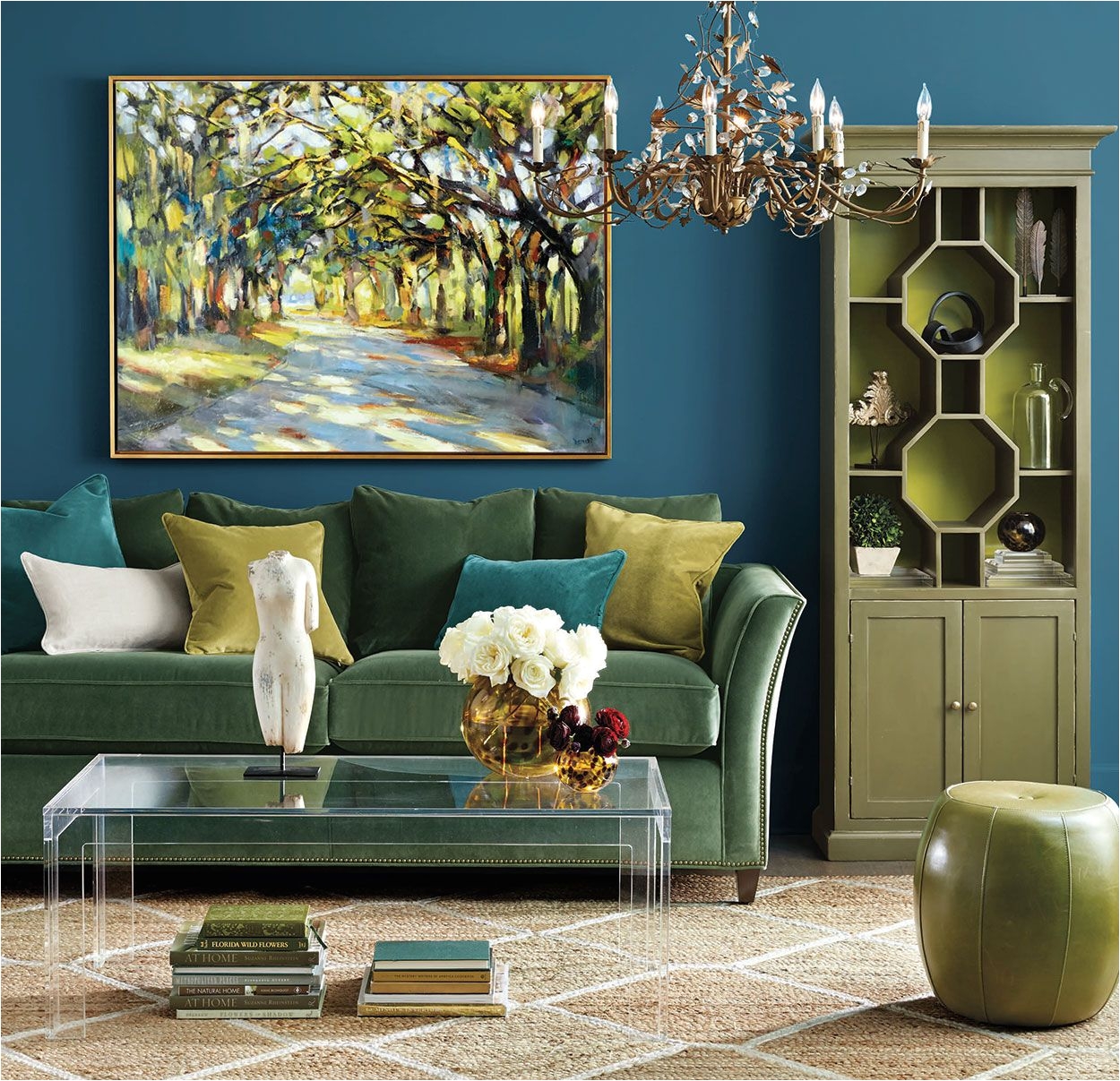 We chose a mixture of jewel tones to give this luxe living room space a dramatic look Accented with gold it s the perfect spot for curling up during