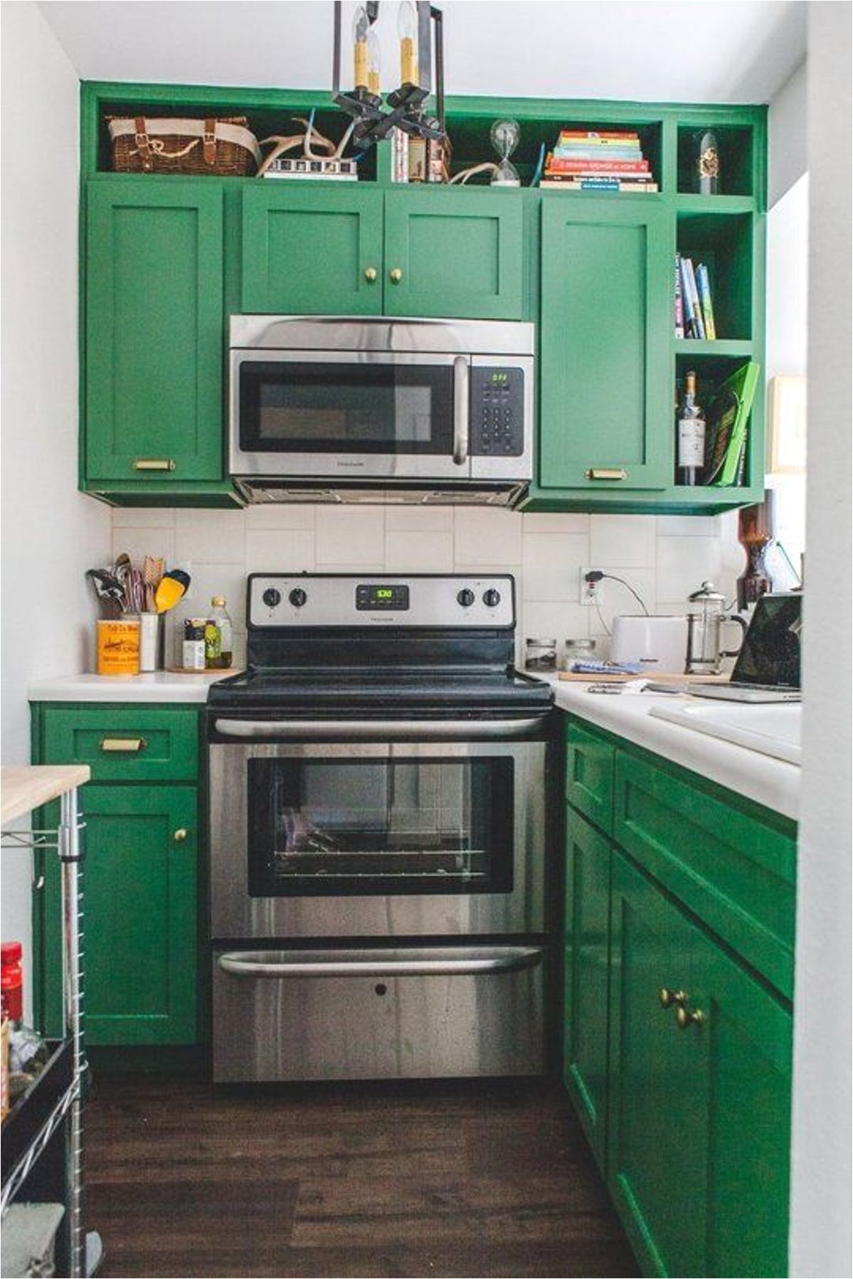 Very Small Kitchen With Green Painted Cabinets And Stainless Steel Appliances