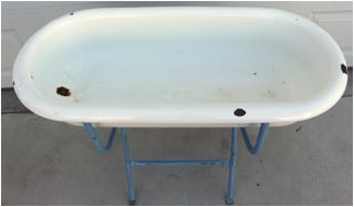 very unusual antique enamel baby bathtub on stand