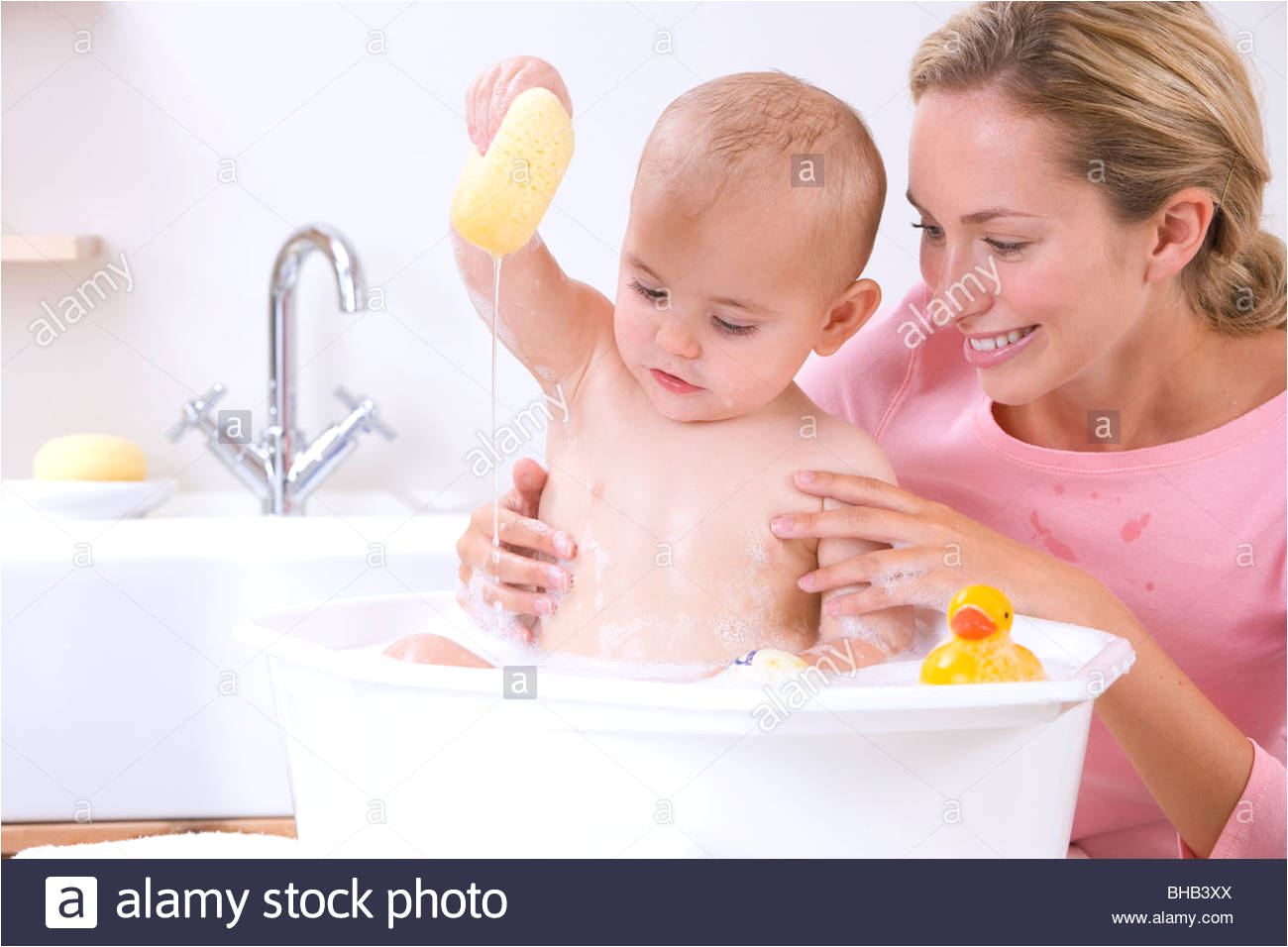 mother and baby bathing