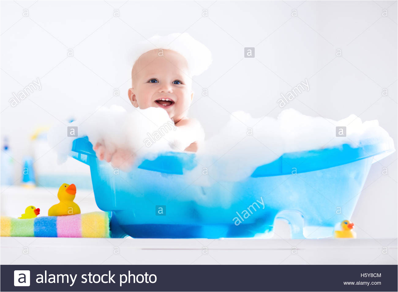 stock photo happy laughing baby taking a bath playing with foam bubbles little