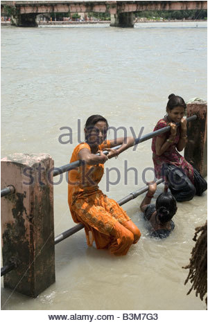 stock photo girl bathing in holy river of india
