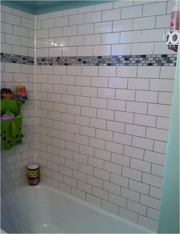 white subway tile tub surround