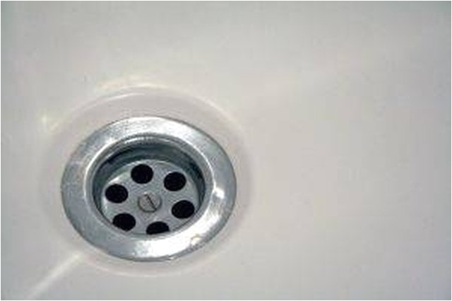 how to remove a bathtub drain cover