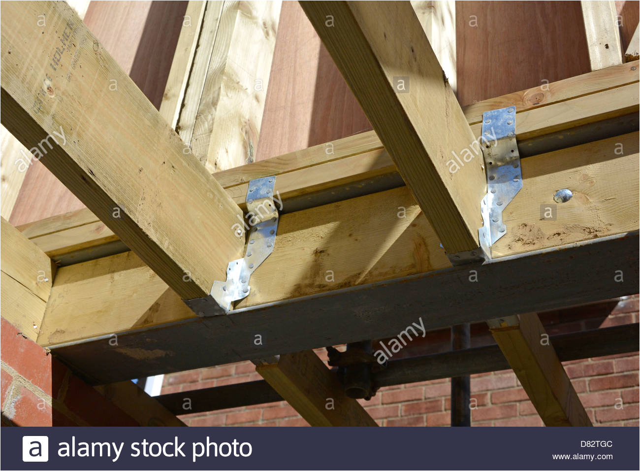 stock photo timber floor joists pressed steel joint connectors to new first floor