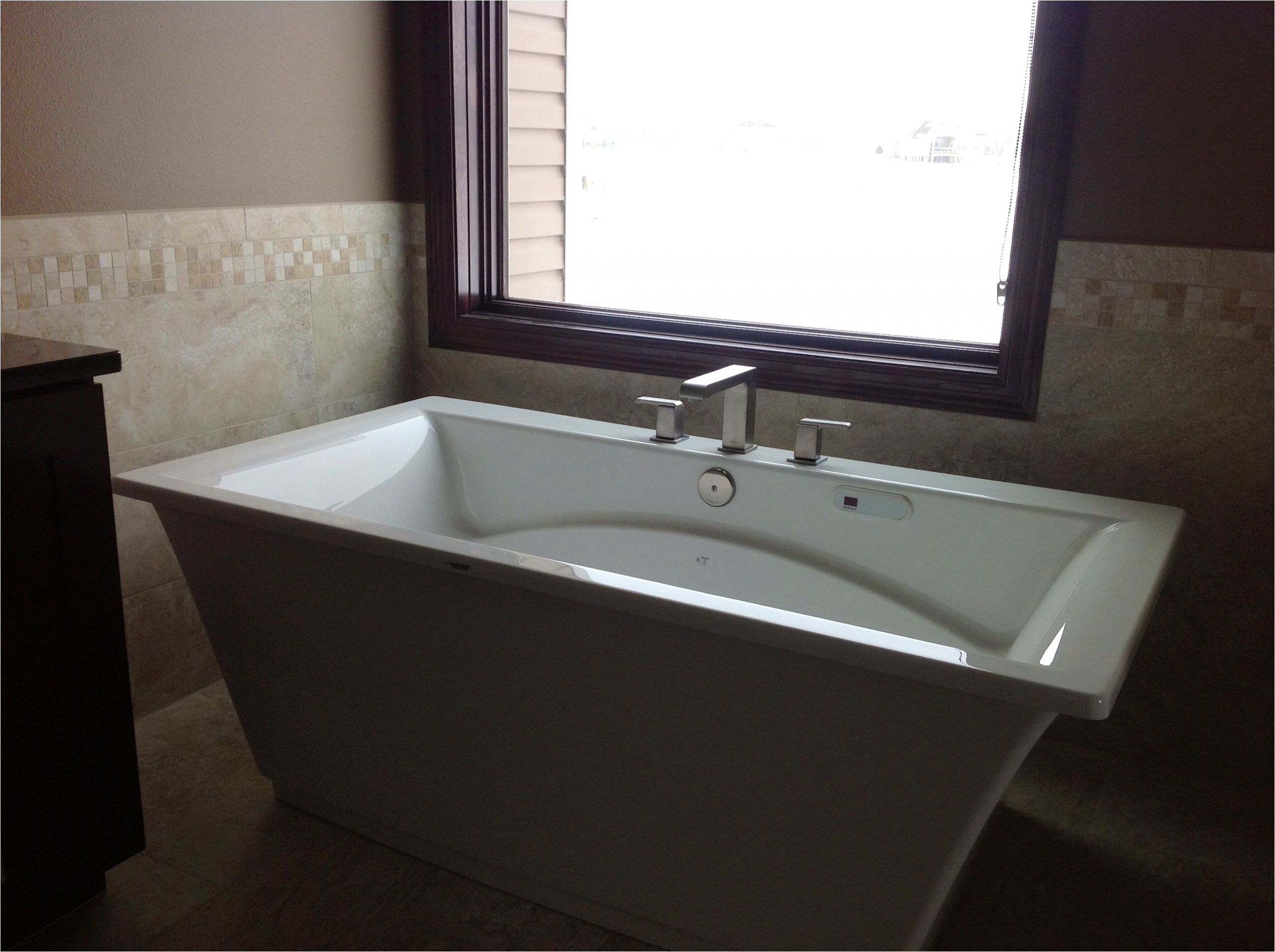 freestanding tub with deck mount faucet