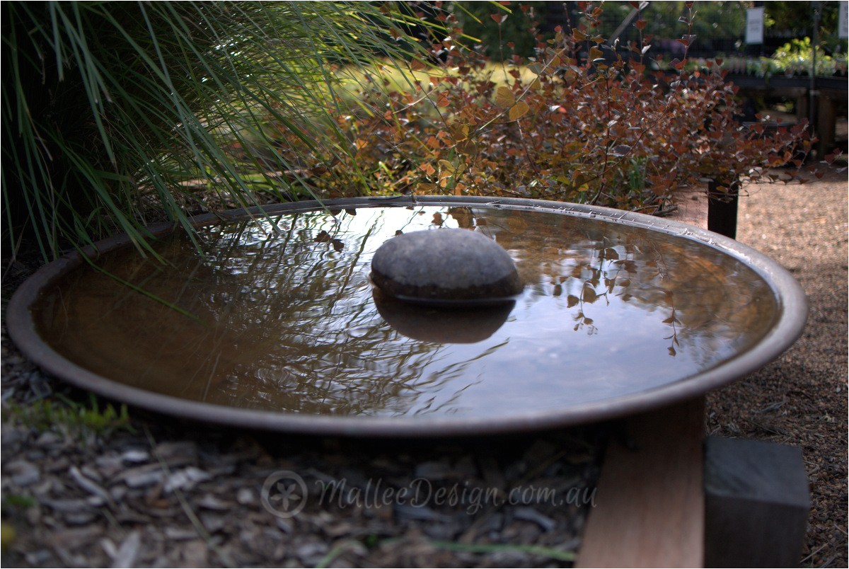 mallee spun copper bird baths and water bowls on display at sydney wildflower nursery