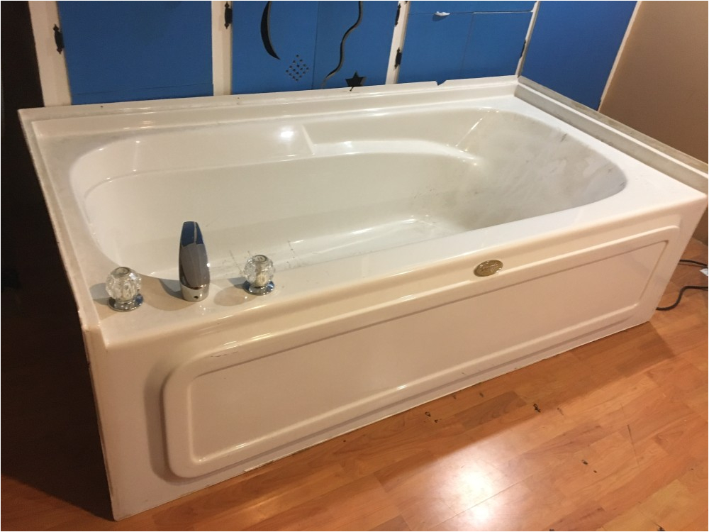 large jacuzzi brand tub with faucet