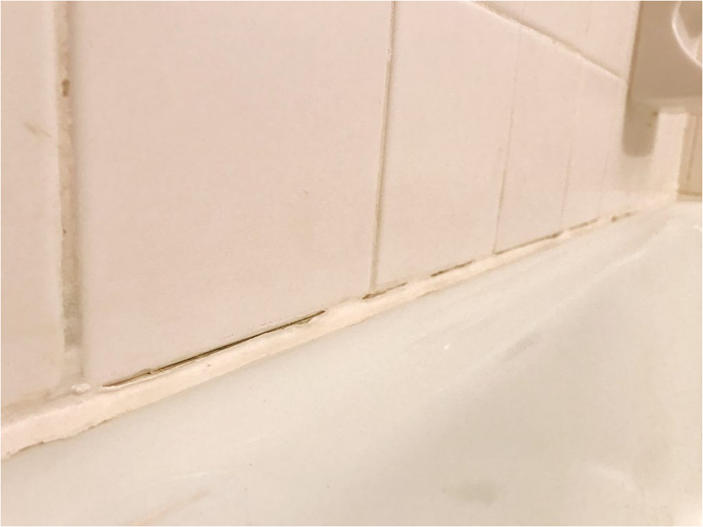 replace old caulk bathtub