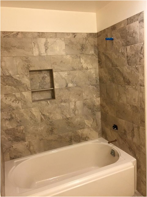 tub surround vs tile