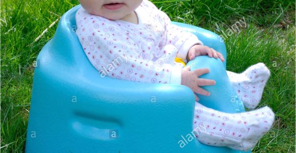 Baby Bath Seat 5 Month Old Five Month Old Baby Sitting In A Bumbo Baby Seat Stock
