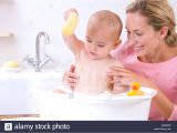 Baby Bath Tub Kenya Mother and Baby Bathing Stock S & Mother and Baby