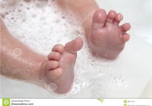 Baby Bath Tub with Legs Baby Feet Wet and soapy Royalty Free Stock Image