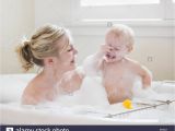 Baby Bathtub Bubbles Mother and Baby Taking A Bubble Bath Stock