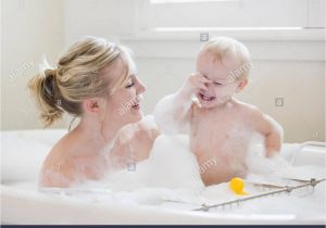 Baby Bathtub Bubbles Mother and Baby Taking A Bubble Bath Stock