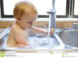Baby Bathtub for Kitchen Sink Baby Taking A Bath In the Sink Stock Image Of Baby