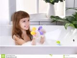 Baby Bathtub Near Me Happy Little Baby Girl Sitting In Bath Tub Playing with