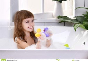 Baby Bathtub Near Me Happy Little Baby Girl Sitting In Bath Tub Playing with