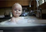 Baby Boy Bathtubs Infant Boy Takes A Bath In Kitchen Sink Stock