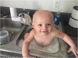 Bathtub Baby Uk Adorable S Show Cop Bathing Baby In Hq’s Sink after