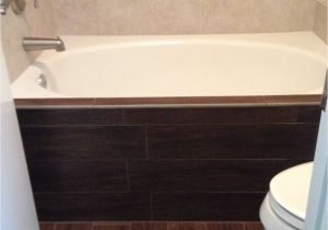 Bathtub Surround Ideas Wood Dark Walnut Wood Tile Floor and Bathtub Face Contrast