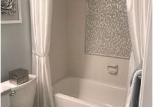 Bathtub Surround Peeling Added Strips Of Peel and Stick Tile to Edge Of Mirror