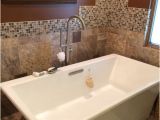 Bathtub Surround with Ceiling Bathroom Remodel Designed by Jen Floor to Ceiling Kohler