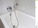 Bathtubs soaking Z Bath Tub with Shower attachment Stock Image