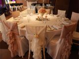 Cheap Wedding Chair Cover Rentals Near Me In the Photograph Ivory Chiffon Ruffles On White Chiavari Chairs are