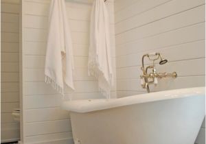 Clawfoot Bathtub Storage Cottage Full Bathroom with Clawfoot Penny Tile Floors