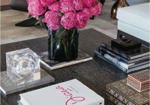 Fake Chanel Books for Decor Hot Pink Floral Arrangement Takes Center Stage On This Coffee Table