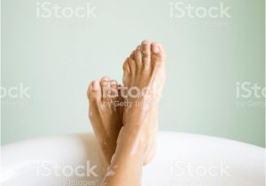 Foot Bathtub with Bubbles Womans Legs and Feet In Bathtub with Bubbles Stock