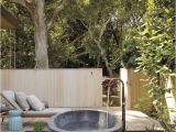 Freestanding Bathtub Garden A Serene Outdoor Bathing area Features A Barcelona Tub by