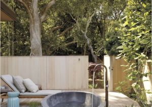 Freestanding Bathtub Garden A Serene Outdoor Bathing area Features A Barcelona Tub by
