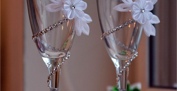 How to Decorate Large Champagne Glasses Maybe Just One Flower On the Brides Haha but the Diamonds are An