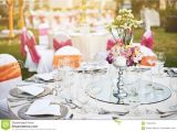 Light Pink Table Cloth Wedding Reception Dinner Table Setting Outdoors with Warm Light