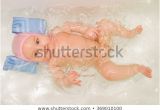 Newborn Baby Girl Bathtub Baby Girl Smiles Bubbles Floating Around Stock