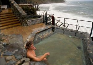 Outdoor Bathtub Big Sur Man soaking Bathing Watching Winter Storm Over Ocean